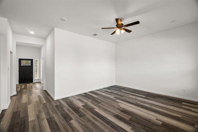 unfurnished room featuring ceiling fan and dark wood-type flooring