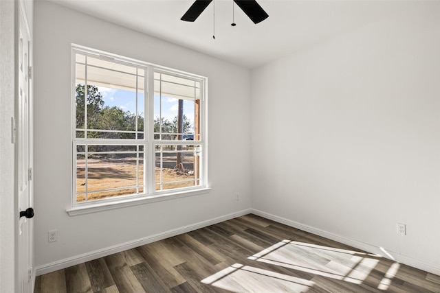 spare room featuring ceiling fan and dark hardwood / wood-style flooring