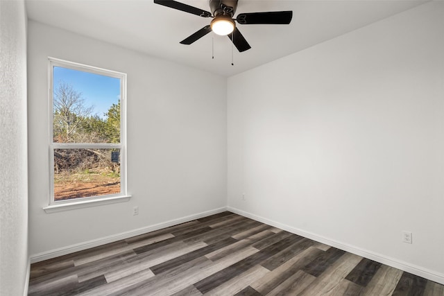 unfurnished room with ceiling fan, dark hardwood / wood-style floors, and a wealth of natural light