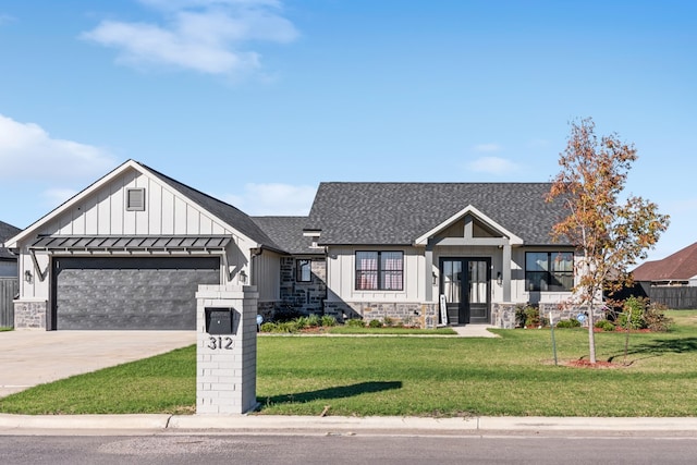 view of front of home with french doors, a front lawn, and a garage