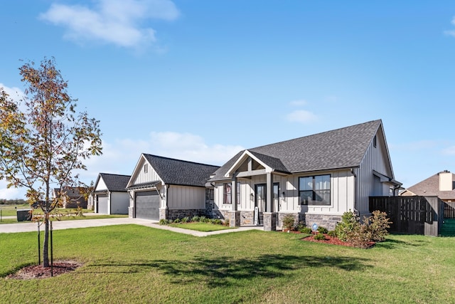 view of front of home with a garage and a front lawn