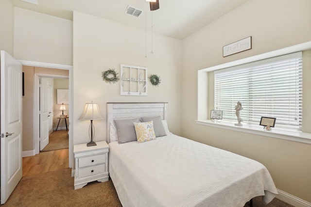 bedroom with ceiling fan and carpet floors