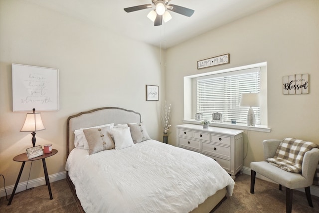 bedroom featuring dark colored carpet and ceiling fan