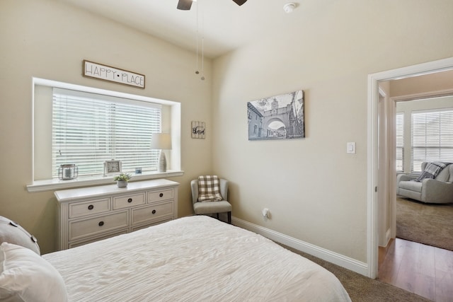 bedroom with hardwood / wood-style flooring and ceiling fan