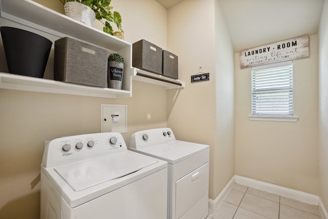 washroom featuring light tile patterned floors and separate washer and dryer