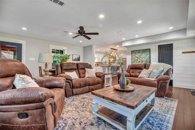 living room featuring recessed lighting, visible vents, and hardwood / wood-style floors