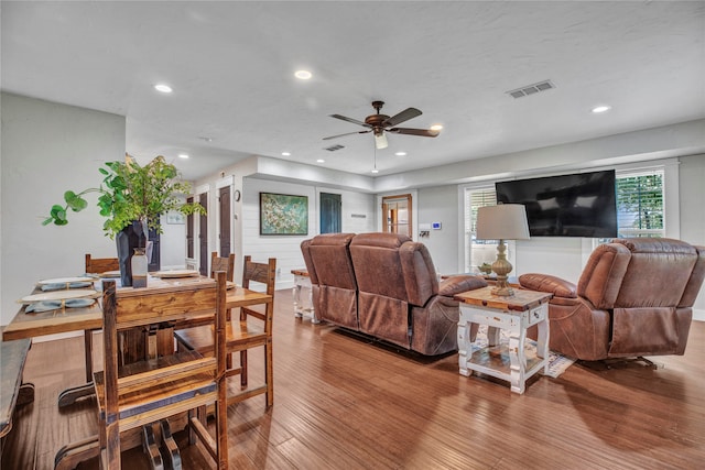 living room with recessed lighting, visible vents, wood finished floors, and ceiling fan