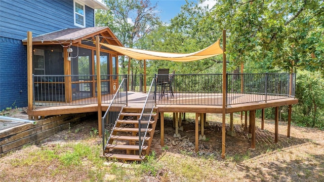 deck featuring stairway and a sunroom