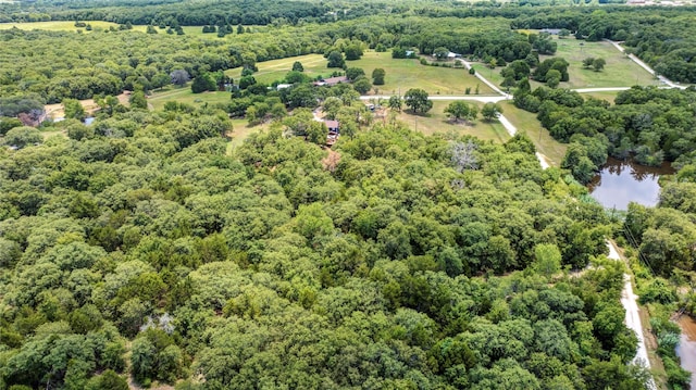 birds eye view of property with a wooded view