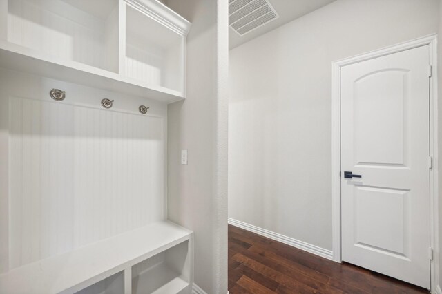 mudroom featuring dark wood-type flooring