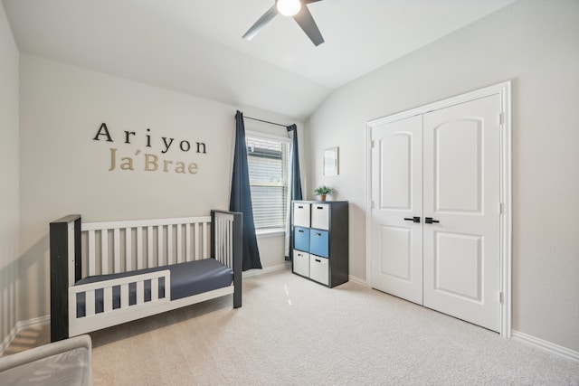 bedroom featuring carpet flooring, a crib, ceiling fan, and lofted ceiling