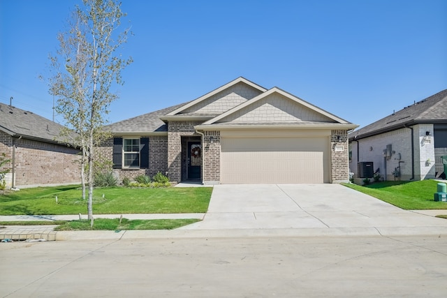 view of front of home featuring cooling unit, a garage, and a front yard