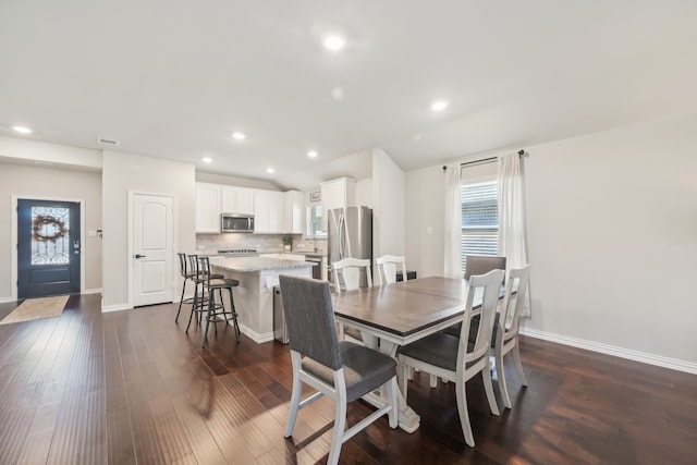 dining area featuring dark hardwood / wood-style floors