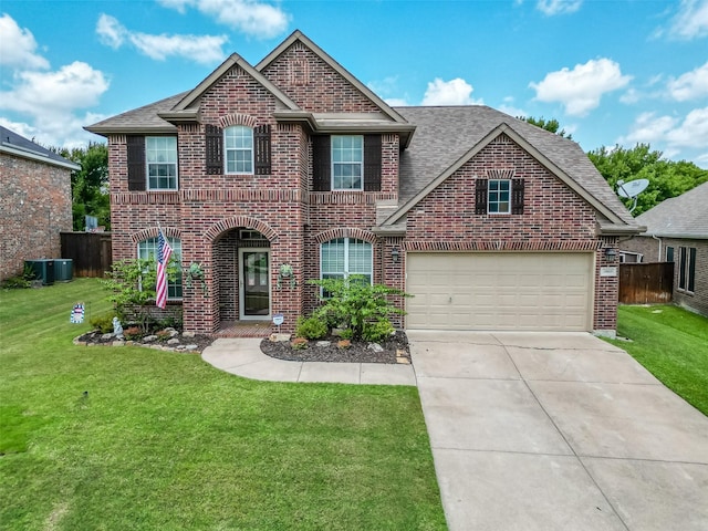 view of front of property with a front yard and a garage