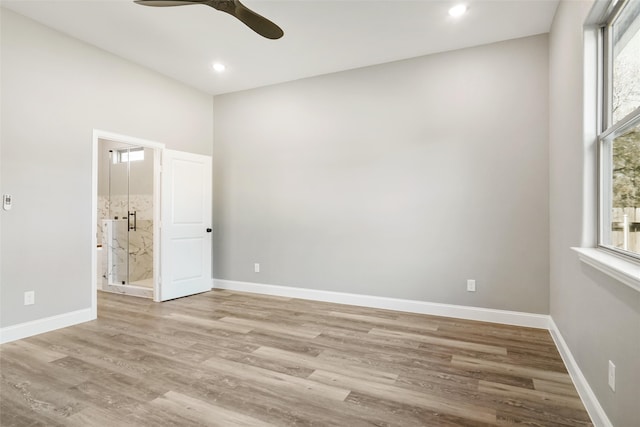 spare room featuring ceiling fan and light hardwood / wood-style flooring