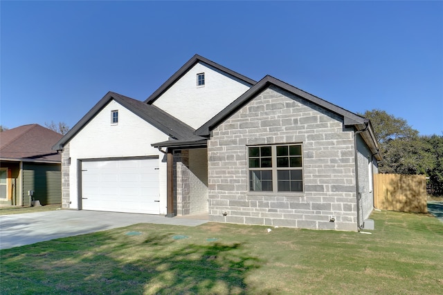 view of front of home featuring a front lawn and a garage