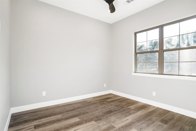 unfurnished room with hardwood / wood-style floors