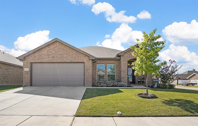 view of front facade featuring a garage and a front yard