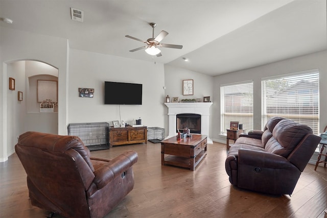 living room featuring ceiling fan, hardwood / wood-style floors, and lofted ceiling