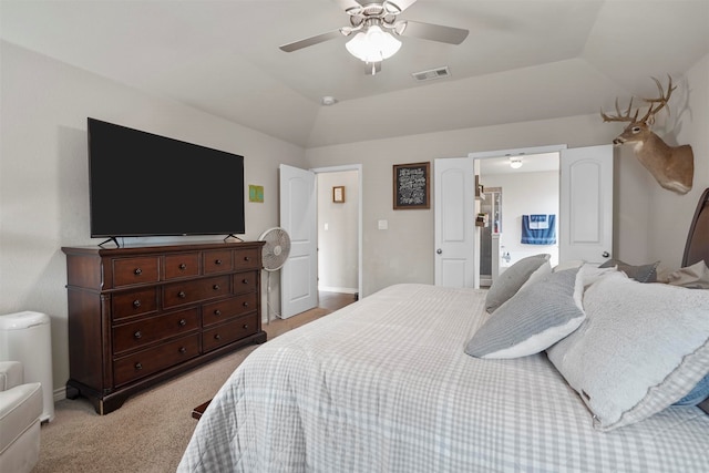 bedroom with light colored carpet, ceiling fan, and lofted ceiling