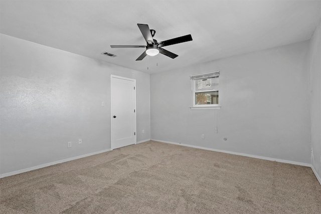 empty room with ceiling fan and carpet