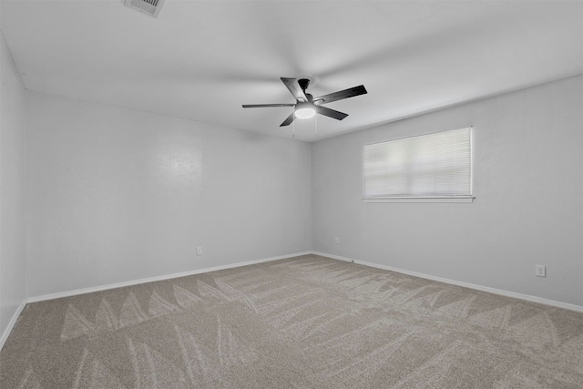 spare room featuring carpet flooring and ceiling fan