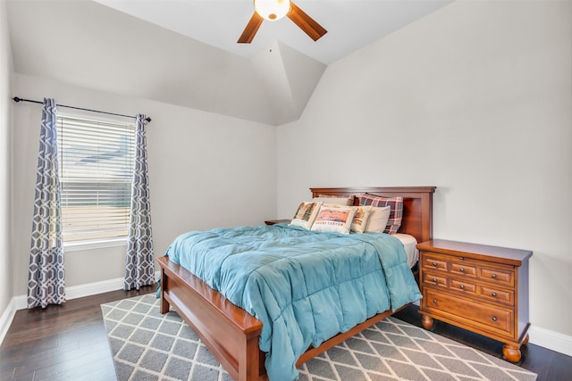 bedroom with ceiling fan, dark hardwood / wood-style floors, and vaulted ceiling