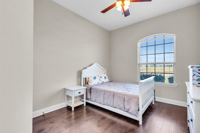 bedroom featuring ceiling fan and dark hardwood / wood-style flooring