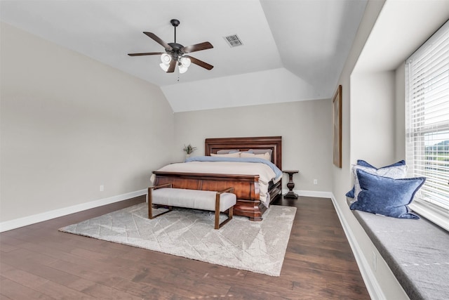 bedroom with ceiling fan, dark hardwood / wood-style flooring, and vaulted ceiling