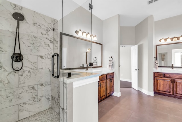 bathroom with vanity and an enclosed shower