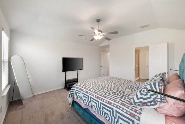 bedroom with vaulted ceiling, ceiling fan, and light colored carpet