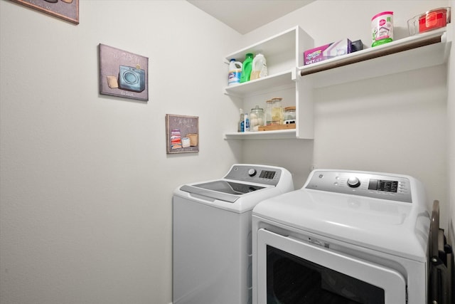 laundry area with washing machine and dryer