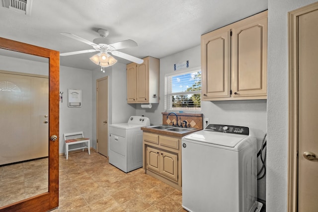 laundry room featuring washer and clothes dryer, ceiling fan, cabinets, and sink