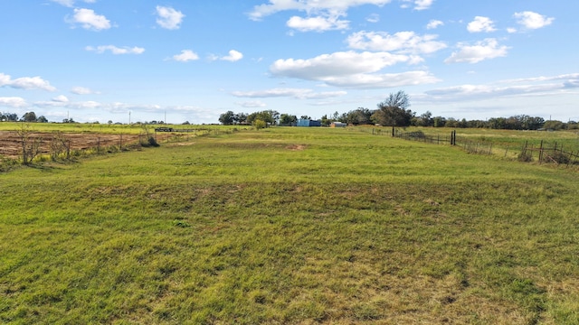 view of yard with a rural view