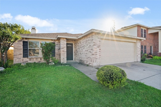 ranch-style home with a garage and a front lawn