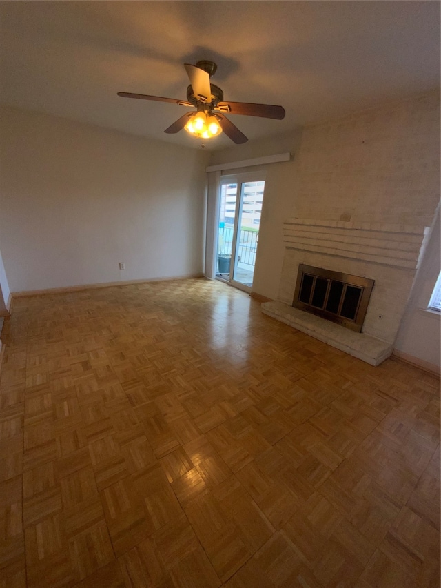 unfurnished living room with ceiling fan and light parquet floors