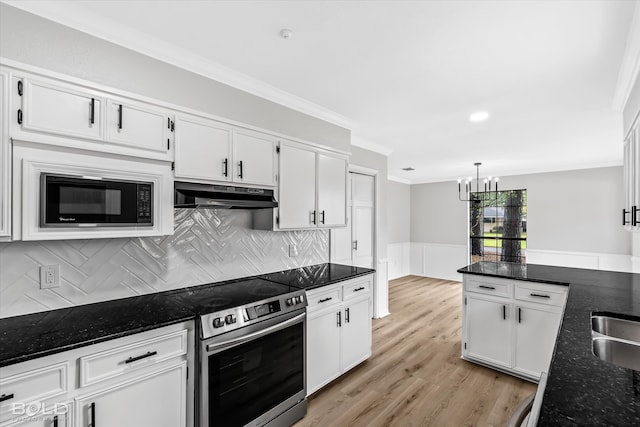 kitchen with dark stone counters, stainless steel electric stove, built in microwave, tasteful backsplash, and white cabinetry