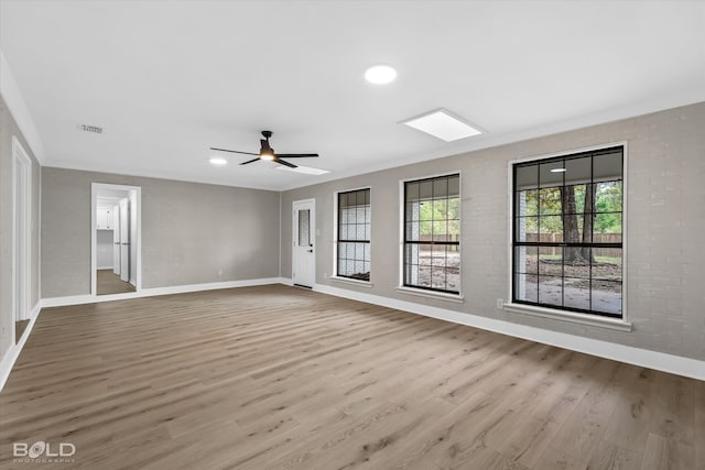 empty room with ceiling fan and light wood-type flooring