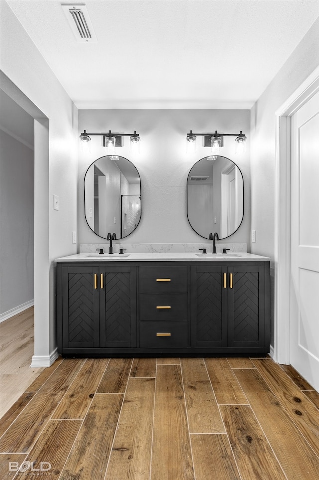 bathroom featuring hardwood / wood-style floors and vanity