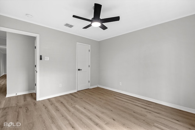 empty room with ceiling fan and light wood-type flooring