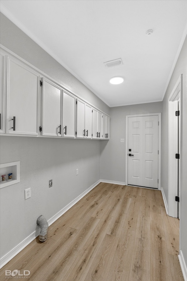 laundry room featuring cabinets, washer hookup, light wood-type flooring, crown molding, and electric dryer hookup