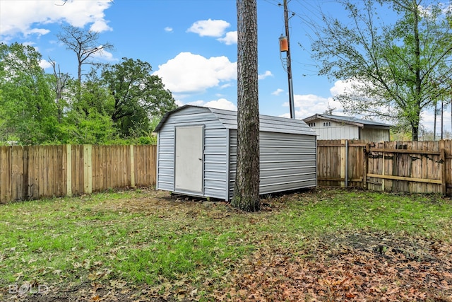 view of outbuilding featuring a lawn