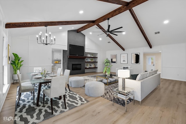 living room with a fireplace, light hardwood / wood-style flooring, beamed ceiling, and high vaulted ceiling