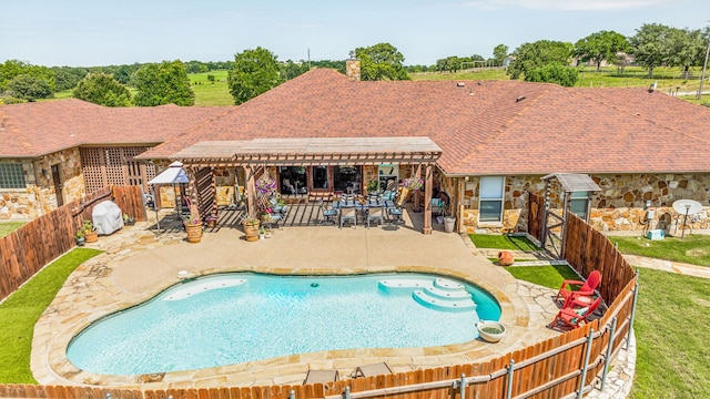 view of pool with a patio area and a pergola