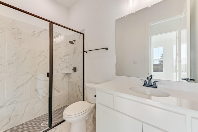 bathroom with vanity, toilet, and an enclosed shower