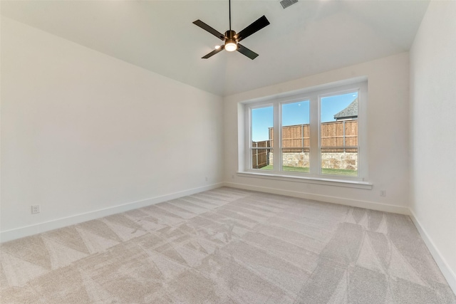 unfurnished room with ceiling fan, light carpet, and high vaulted ceiling