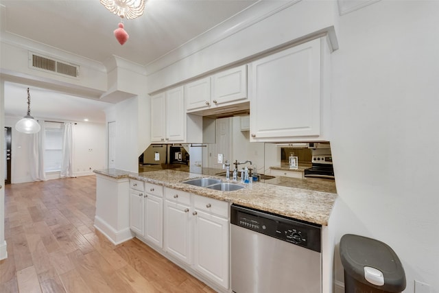 kitchen featuring light hardwood / wood-style flooring, decorative light fixtures, white cabinetry, appliances with stainless steel finishes, and sink