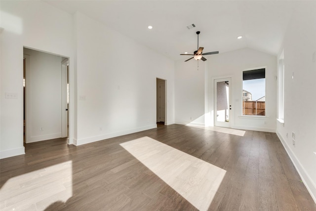 unfurnished living room with ceiling fan, wood-type flooring, and vaulted ceiling