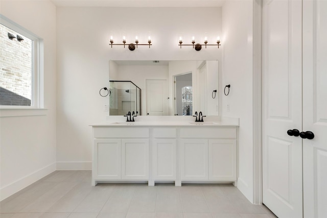 bathroom with tile patterned flooring, vanity, and an enclosed shower