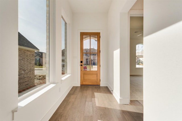 hall with light hardwood / wood-style floors